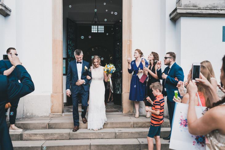 the bridge and groom exit the church