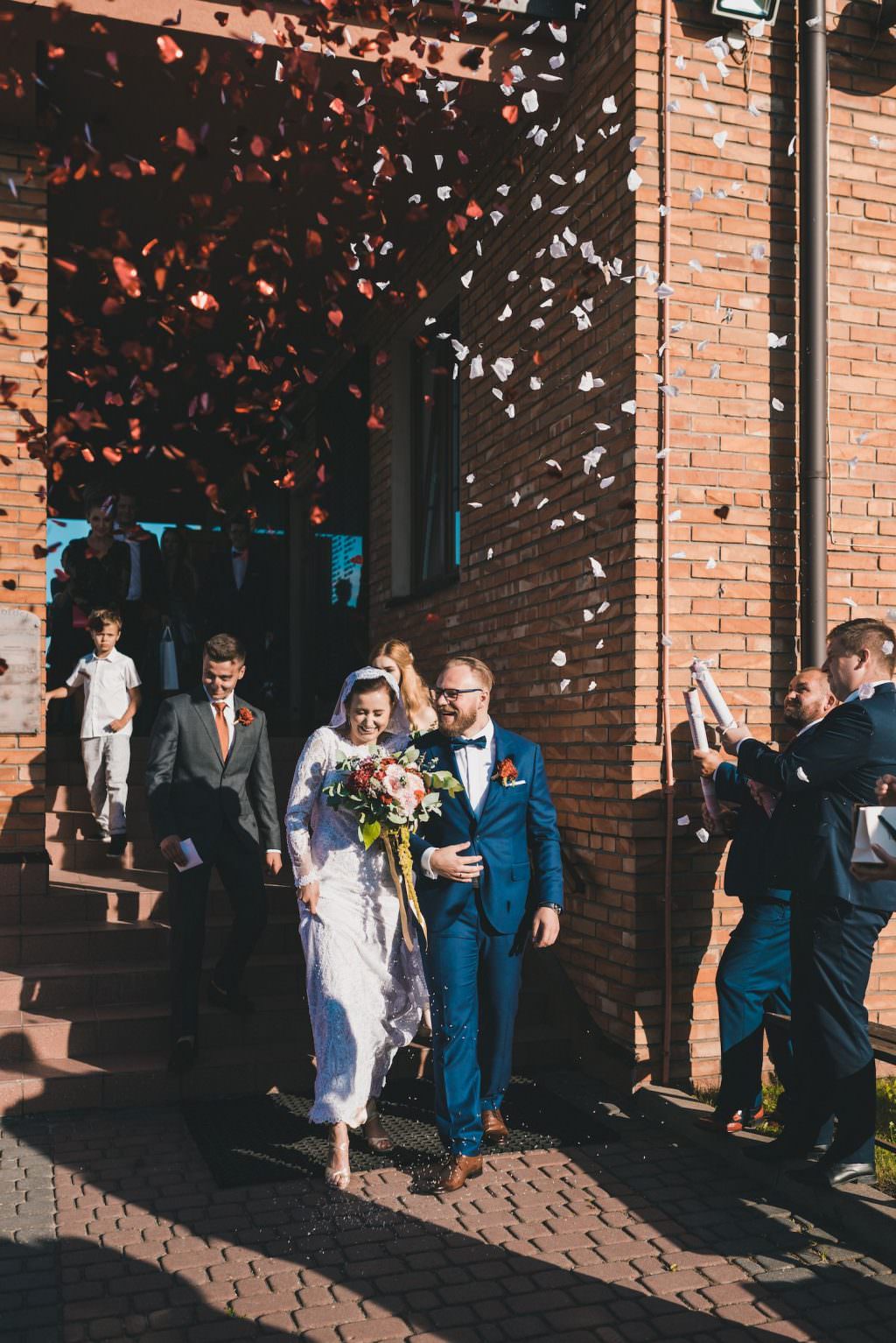 confetti over the married couple sun