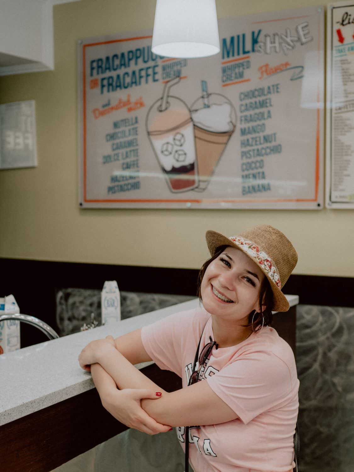 Happy girl in ice cream caffee