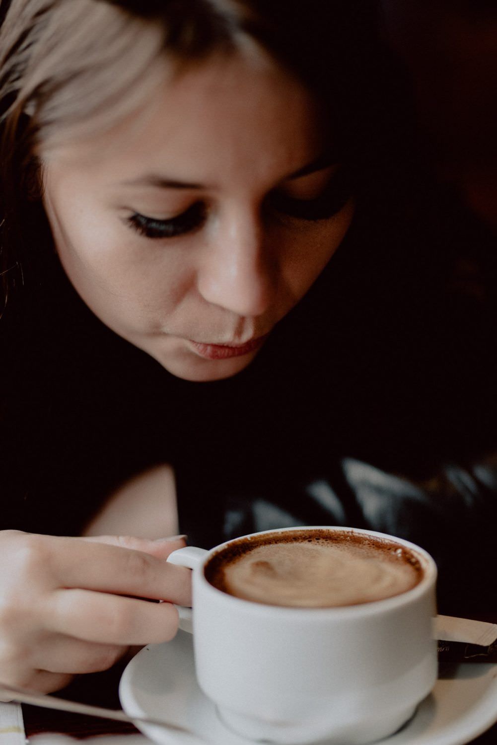 girl puffs for hot coffee