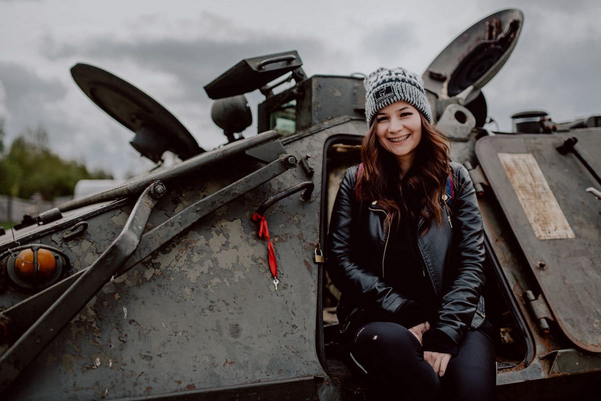 happy girl in military vehicle