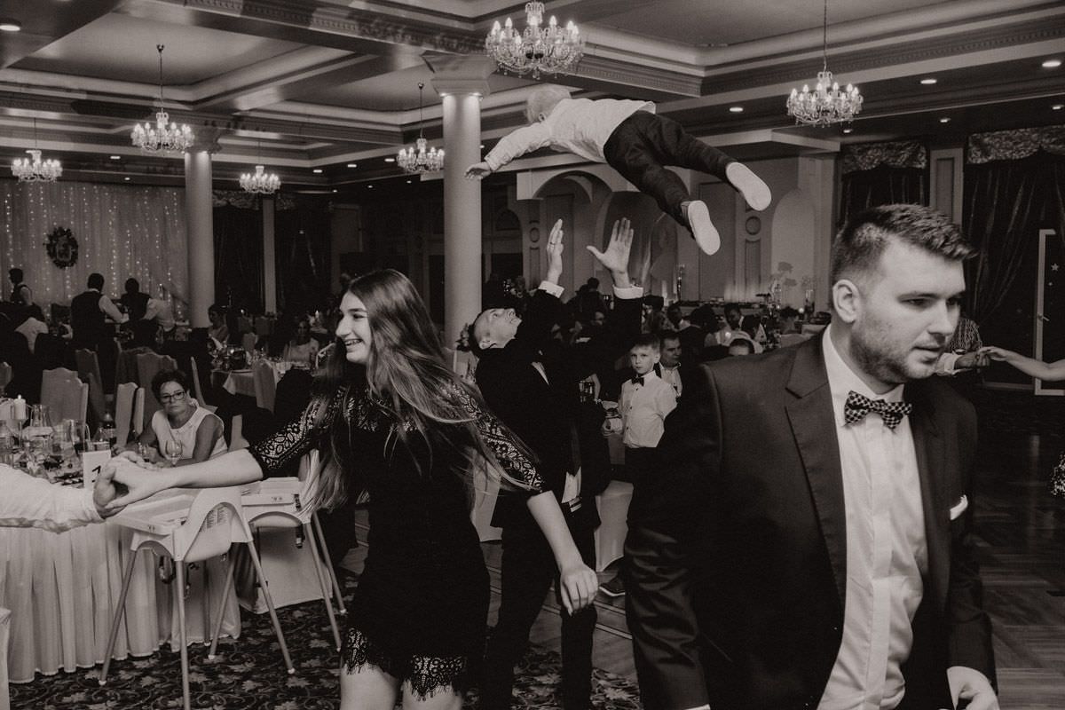child in the air on wedding party